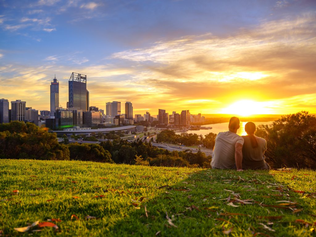 Watching the sunrise at Kings Park and Botanic Garden with the Perth Skyline in the background.  Copyright tourism.wa.gov.au